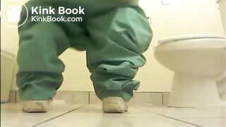 Girl shitting on the floor of the toilet