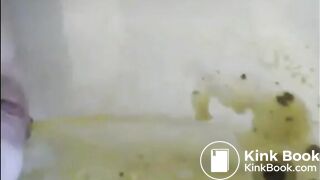 Woman is shitting a very liquid diarrhea in the bathtub