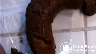 Woman shitting a long hard turd