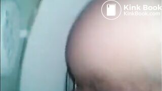 Woman shitting in the toilet closeup