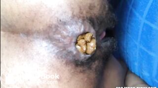 Hairy girl shitting an hard turd