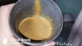 Pissing out of ass in cup