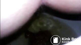Girl shitting diarrhea in the toilet closeup