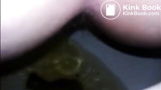 Girl shitting diarrhea in the toilet closeup