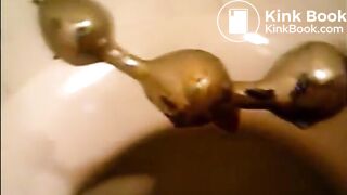Girl shitting in the toilet and inserting dildo on her asshole
