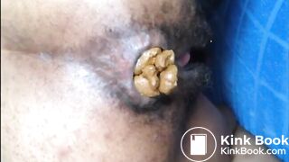 Hairy asshole ebony shitting closeup