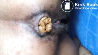 Hairy asshole ebony shitting closeup