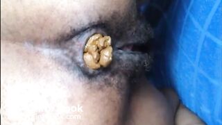 Hairy asshole ebony shitting closeup