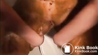 Woman shitting diarrhea and smearing it on her body