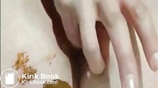 Shaved girl shitting closeup and fingering her pussy