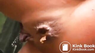 Girl with a pierced clit pooping on the slide