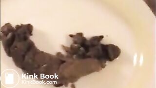 Woman shit big turd on a white plate