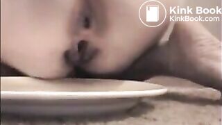 Woman shit big turd on a white plate