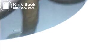 Woman shitting a long turd very slowly in the toilet