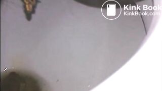 Woman shitting a long turd very slowly in the toilet