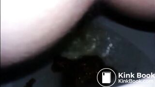Girl shitting diarrhea in the toilet closeup