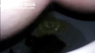 Girl shitting diarrhea in the toilet closeup