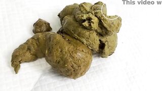 Shitting and playing with her fresh poop