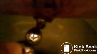 Girl shitting in the toilet and inserting dildo on her asshole