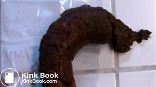 Woman shitting a long hard turd