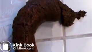 Woman shitting a long hard turd