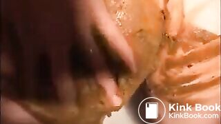 Woman shitting and smearing shit on her body