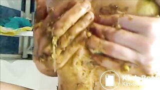 Big woman is smearing shit on her breast