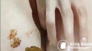 Shaved girl shitting closeup and fingering her pussy