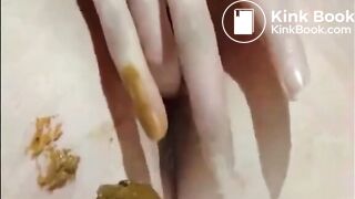 Shaved girl shitting closeup and fingering her pussy