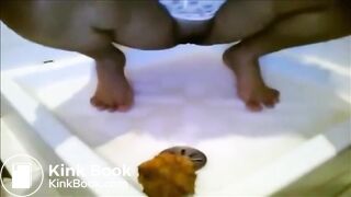 Ebony babe smearing shit on her feet