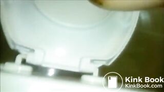 Woman shitting a long turd Closeup