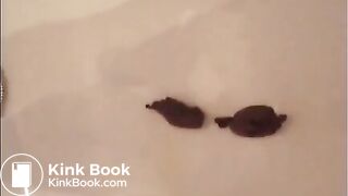 Brunette shitting in the bathtub