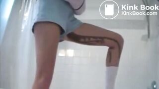 Poop in shorts runs down her leg