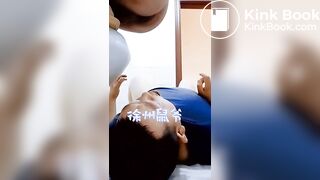 chinese escort feeding a pig