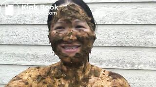 Asian woman smiles covered in scat