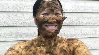 Asian woman smiles covered in scat