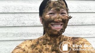 Asian woman smiles covered in scat