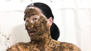 Asian woman laughs covered in scat