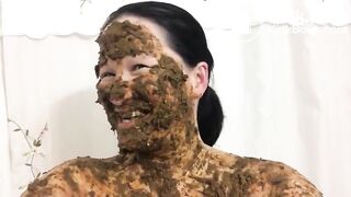 Asian woman laughs covered in scat