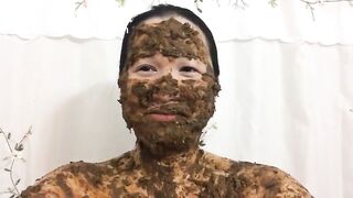 Asian woman laughs covered in scat