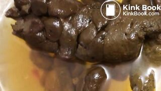 Big thick poop and bright yellow pee in a bowl