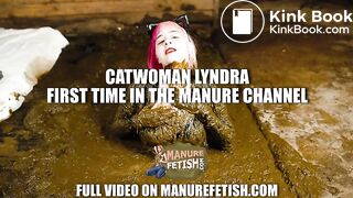 Catwoman Lyndra plays in cowshit