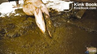 Catwoman Lyndra plays in cowshit