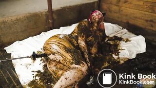 Catwoman Lyndra plays in cowshit