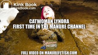 Catwoman Lyndra plays in cowshit