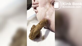 Pushing out a huge load in bed