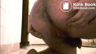 smearing shit on his feet while sitting in piss