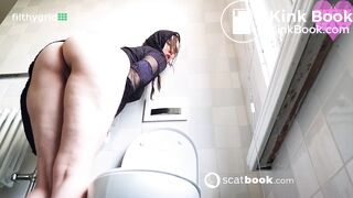 Kitty skatt massive log while squatting on toilet
