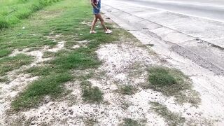 Mesmerizing peeing on the road on a sunny day