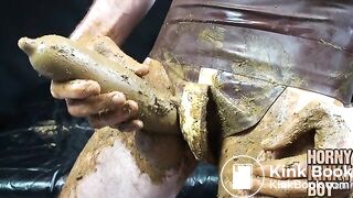 Scat Lover in Brown Rubber Eats and Plays Around